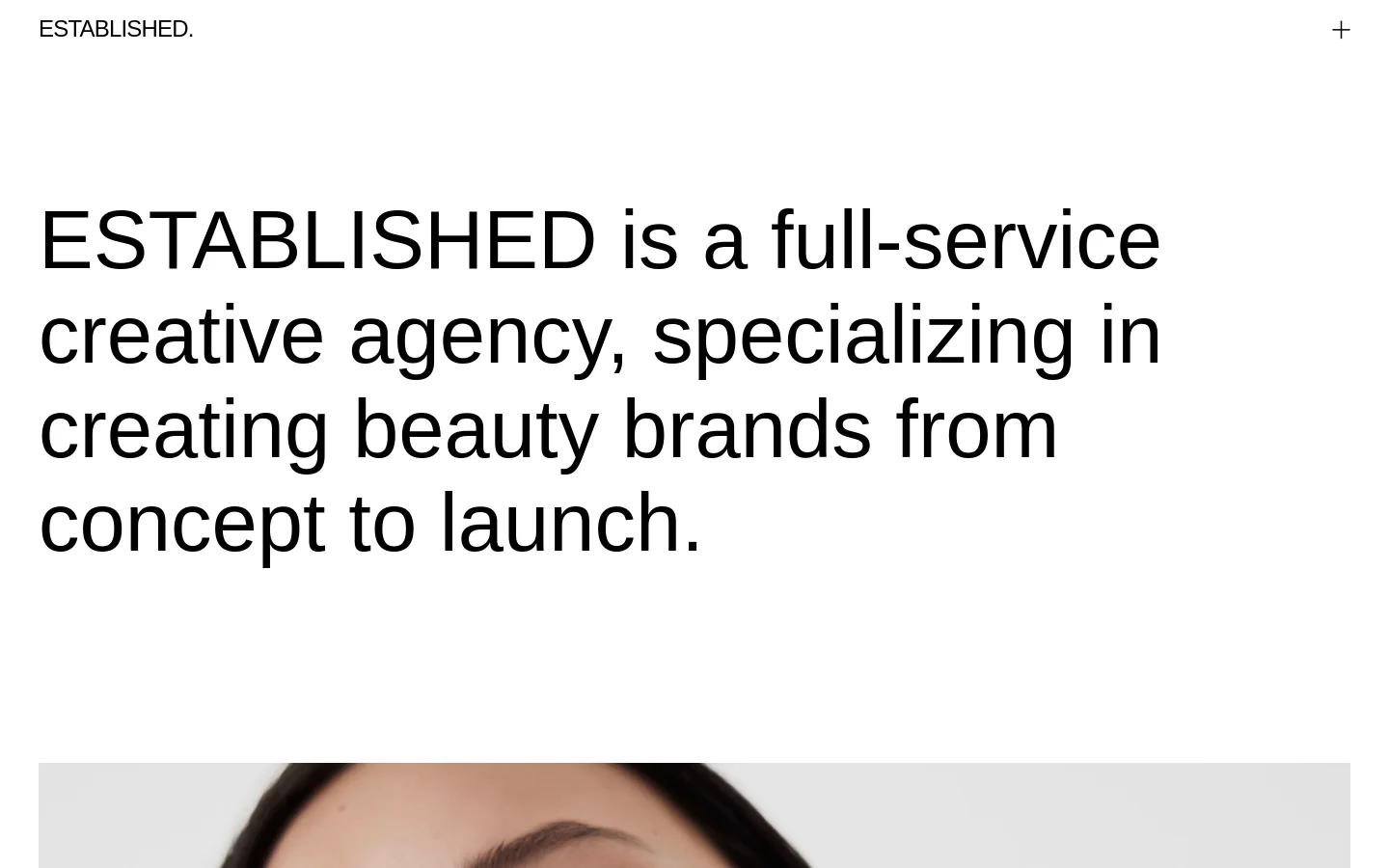 The desktop homepage features a minimalist white background with large black typography stating that ESTABLISHED is a full-service creative agency specializing in beauty brands. Below the headline, a grid of large, high-quality project images showcases various beauty brands like Allies of Skin and Rare Beauty, each accompanied by a title and short description. A navigation menu with links to Archive, Studio, and Contact is accessible via a plus icon in the top right corner.
