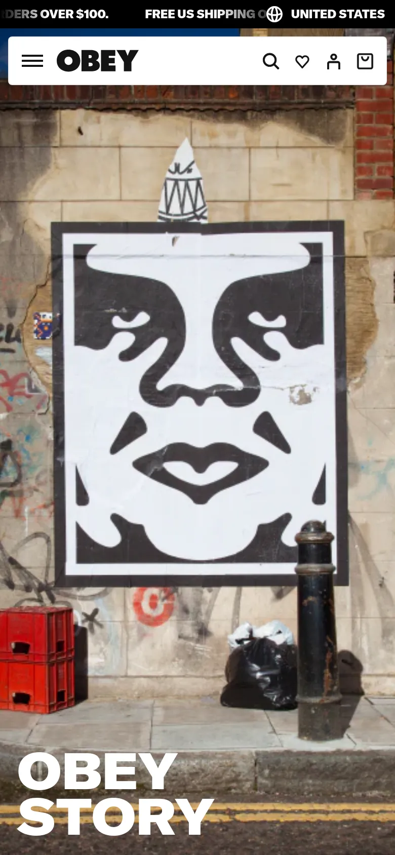 The mobile version presents a vertically oriented view of the same black and white face graphic on a graffiti wall, cropped more tightly to the central image. The header is condensed into a hamburger menu icon on the left, the OBEY logo in the center, and search, heart, user, and bag icons on the right. The 'OBEY STORY' text is prominently displayed in large white letters at the bottom.