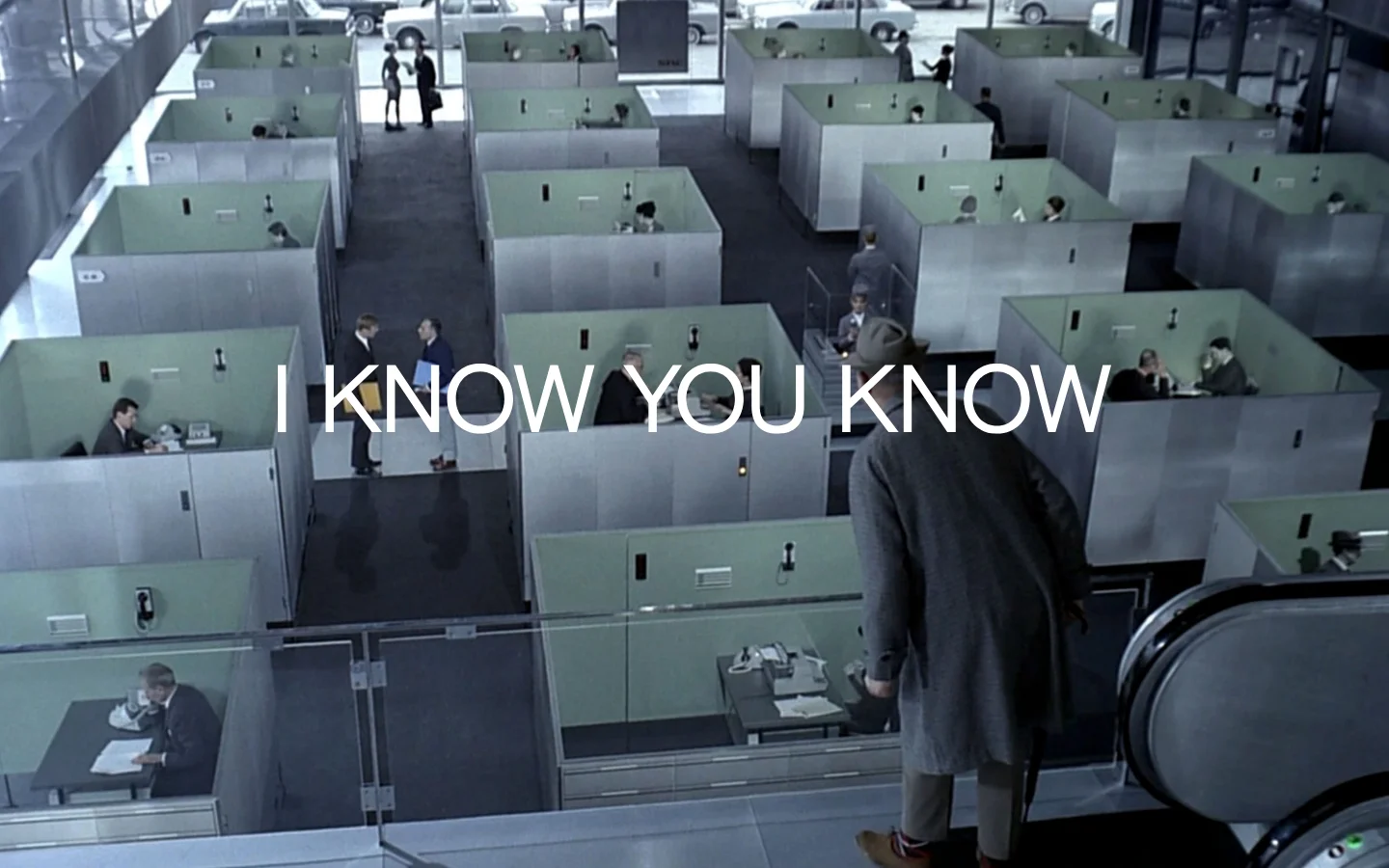The desktop homepage features a large, cinematic hero image of a mid-century office with cubicles, overlaid with the white text 'I KNOW YOU KNOW'. Below the hero section, a minimalist white layout displays a list of creative services followed by a grid of portfolio projects with large images and client names.