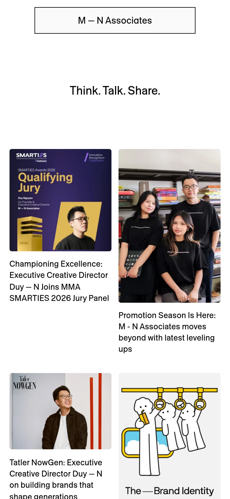 The mobile version maintains the minimalist white aesthetic but transitions the article layout into a single-column vertical stack. The headlines and images are scaled to fit the narrower screen width, ensuring readability for a vertical scroll.