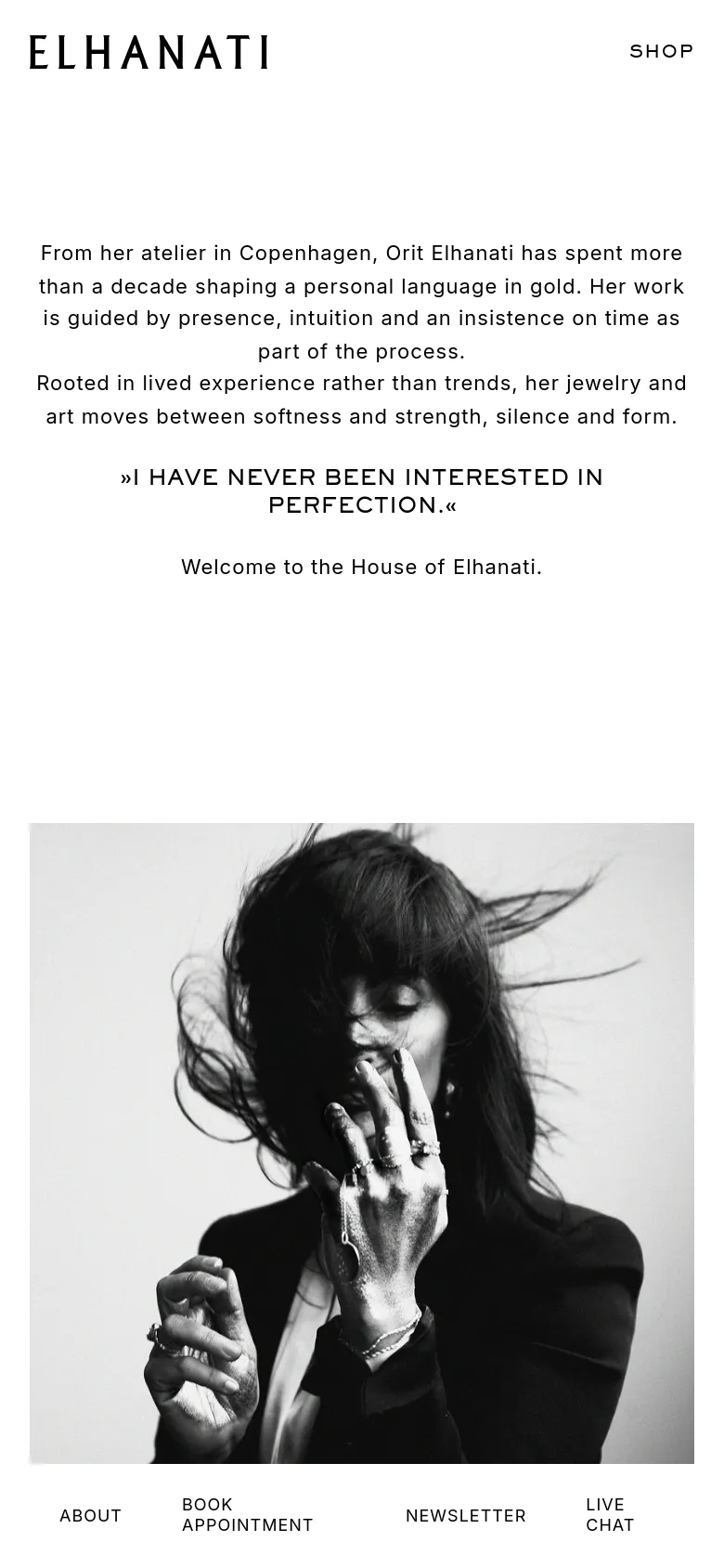 The mobile version maintains the minimalist black and white aesthetic but uses a vertical layout. The text is centered, and the navigation menu is moved to a bottom bar containing links for About, Book Appointment, Newsletter, and Live Chat. The large black and white portrait remains a central visual element below the introductory text.
