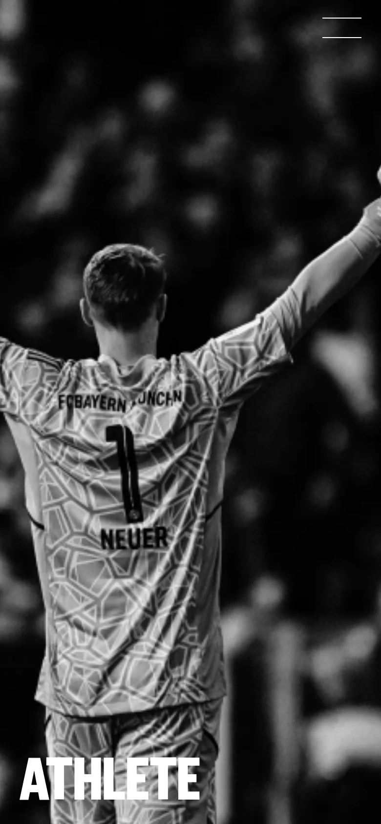 The mobile version shows a vertically cropped version of the black and white hero image, focusing on Neuer's back and raised arms. The 'ATHLETE' text remains at the bottom, but the composition is tighter to fit the narrow screen, and the navigation menu is condensed into a hamburger icon at the top right.