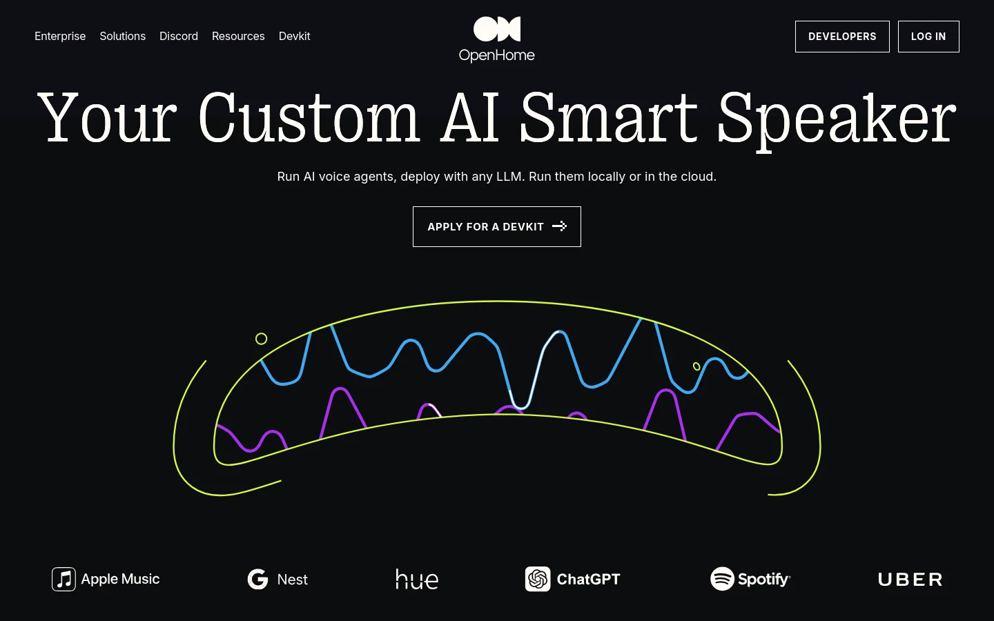 The desktop homepage features a dark theme with a large white headline reading 'Your Custom AI Smart Speaker' and a subheadline about running AI voice agents. A primary call-to-action button labeled 'APPLY FOR A DEVKIT' sits above a colorful, stylized waveform graphic. A navigation bar at the top includes links for Enterprise, Solutions, and Discord, while a row of brand logos like Apple Music and ChatGPT sits at the bottom.