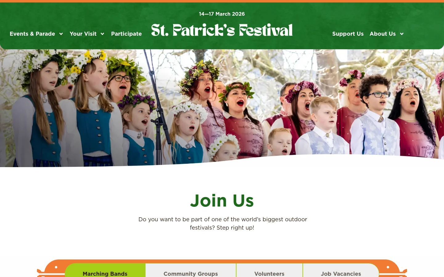 The desktop page features a green header with the St. Patrick's Festival logo and navigation menu, positioned above a large hero image of a choir wearing flower crowns. Below the image, a large 'Join Us' headline is followed by a subtext and a horizontal row of four navigation buttons: Marching Bands, Community Groups, Volunteers, and Job Vacancies.