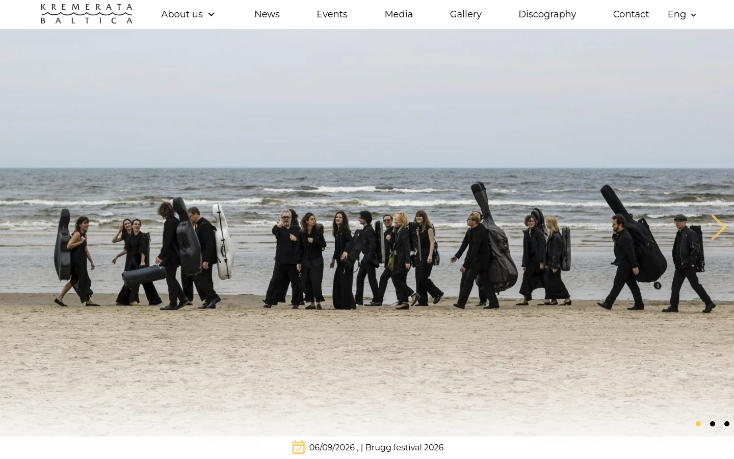 The desktop homepage features a large hero image slider showing orchestra members walking on a beach with instrument cases. A white navigation bar at the top includes the orchestra logo and links for About us, News, Events, Media, Gallery, Discography, and Contact. Below the hero image, a quote by Gidon Kremer is displayed above an introductory text section and an upcoming events grid.
