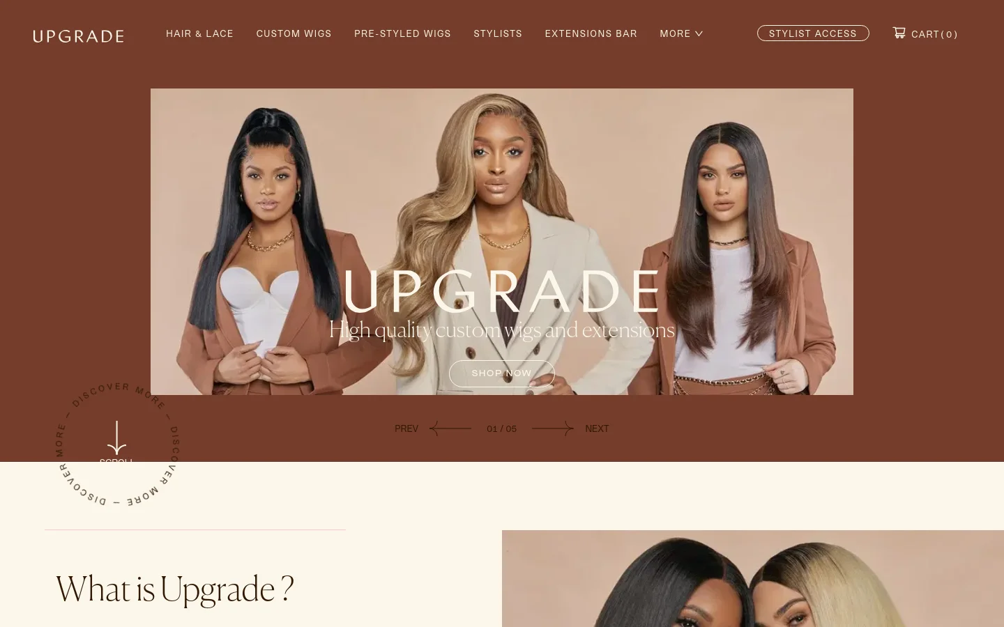 The desktop homepage features a brown and white color scheme with a navigation menu at the top including links for Hair & Lace, Custom Wigs, and Stylists. A large hero banner displays three women with different hair textures and styles, overlaid with the text 'UPGRADE: High quality custom wigs and extensions' and a 'SHOP NOW' button. Below the hero, a section titled 'What is Upgrade?' introduces the brand's mission.