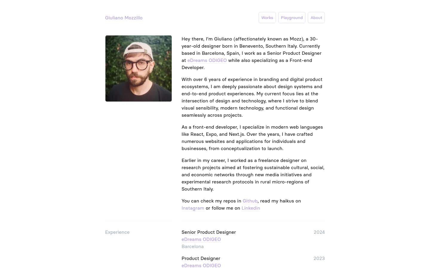 The desktop About page features a minimalist white layout with a navigation bar at the top containing links for Works, Playground, and About. A portrait of Giuliano Mozzillo is positioned on the left, with a multi-paragraph professional biography on the right. Below the bio, an 'Experience' section lists previous job roles and companies in a clean, two-column list format.