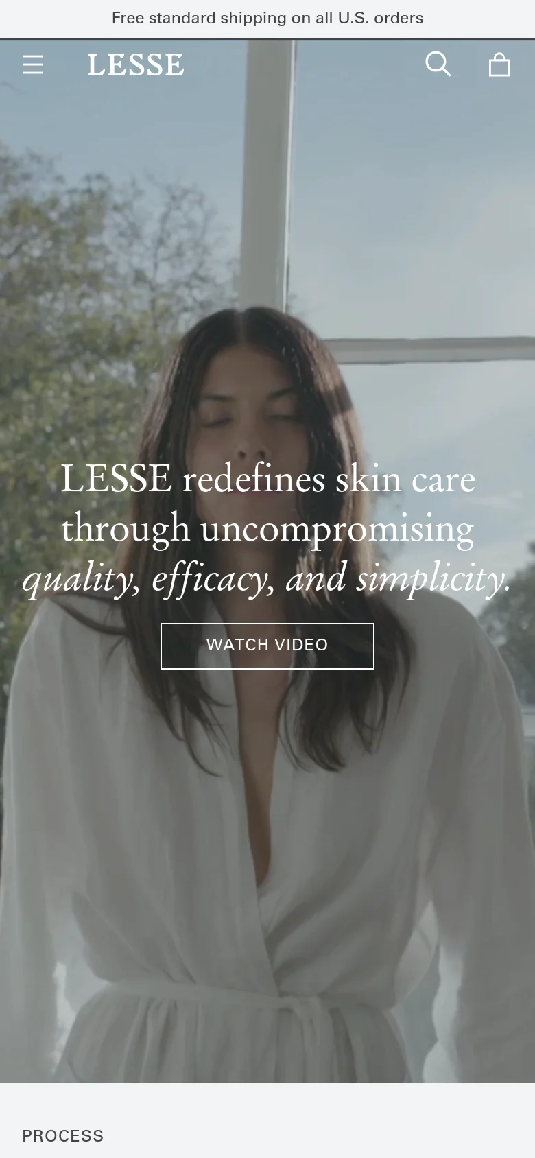 The mobile version maintains the hero imagery of the woman in a white robe but uses a closer, more vertical crop. The navigation is condensed into a hamburger menu icon on the left, with search and shopping bag icons on the right, and the brand name 'LESSE' centered at the top.