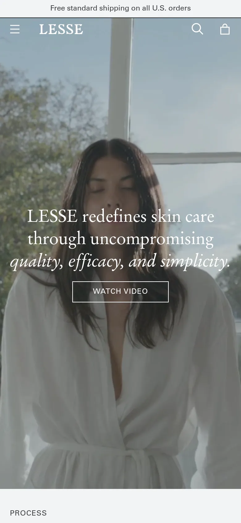 The mobile version maintains the hero imagery of the woman in a white robe but uses a closer, more vertical crop. The navigation is condensed into a hamburger menu icon on the left, with search and shopping bag icons on the right, and the brand name 'LESSE' centered at the top.