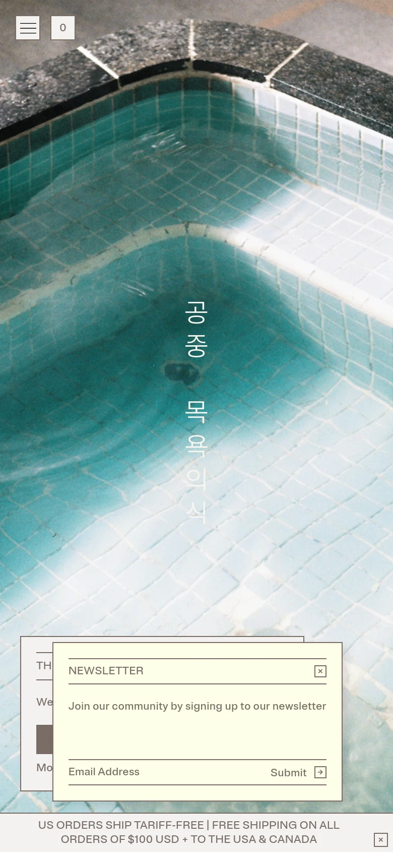 The mobile version presents a full-screen hero image of the tiled bathhouse pool, but the navigation is condensed into a hamburger menu icon in the top left. The layout is more vertical, with the brand name and newsletter signup elements scaled to fit the narrow screen, maintaining the minimalist aesthetic and dark, moody color palette.