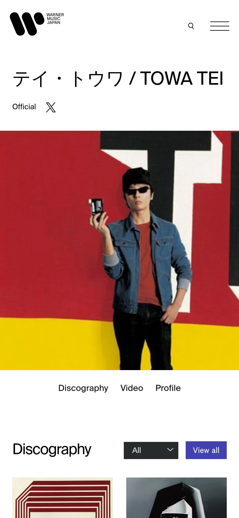 The mobile version simplifies the layout, replacing the top navigation menu with a hamburger icon and a search icon. The artist's name and hero image remain prominent, but the image scales to fill the width of the screen. Navigation links for Discography, Video, and Profile are stacked above the Discography heading, which includes a dropdown filter and a 'View all' button.