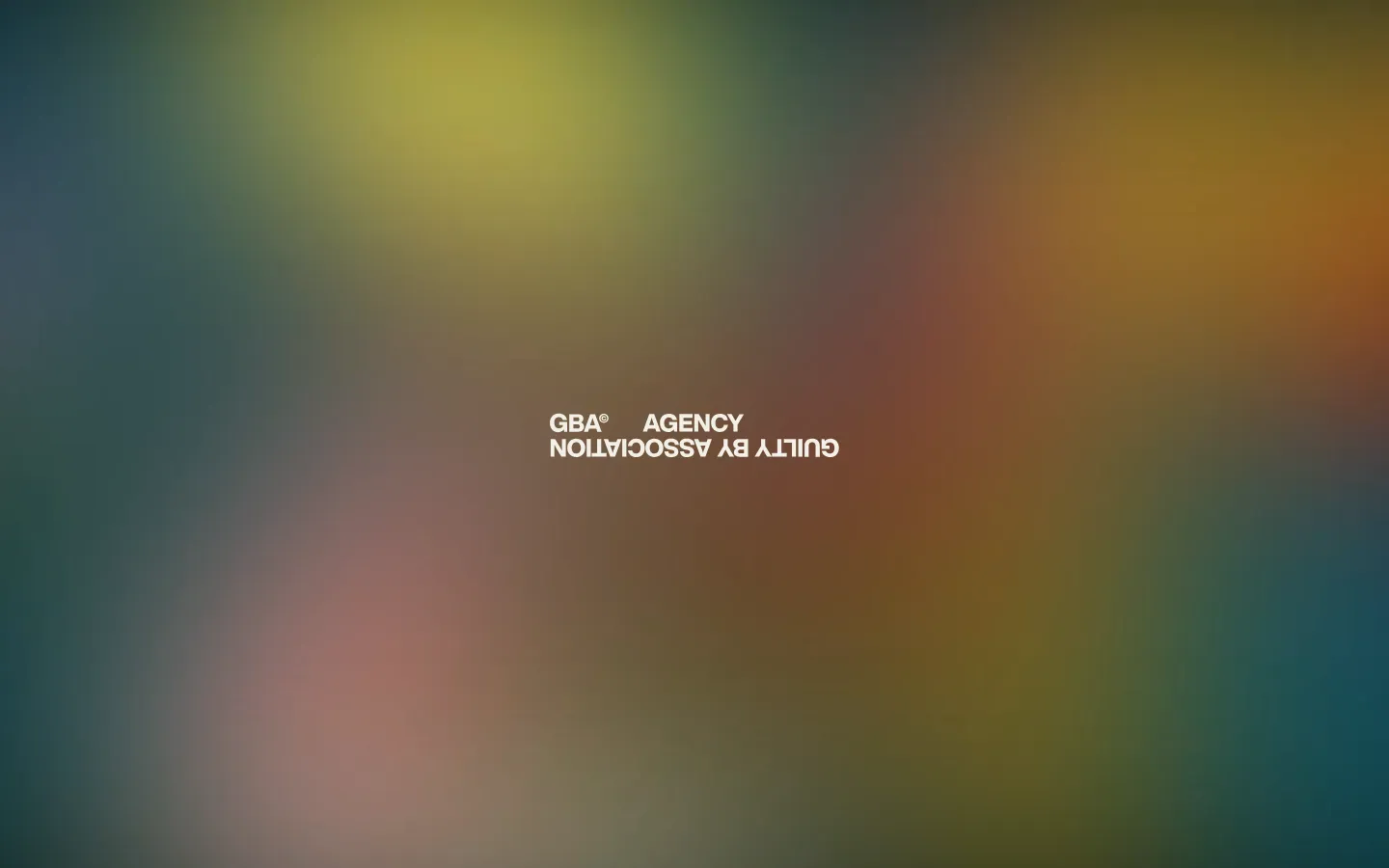 The desktop homepage features a minimalist design with a large, colorful blurred gradient background in shades of teal, yellow, and red. Centered in the frame is the white text 'GBA AGENCY' and 'GUILTY BY ASSOCIATION' displayed upside down.