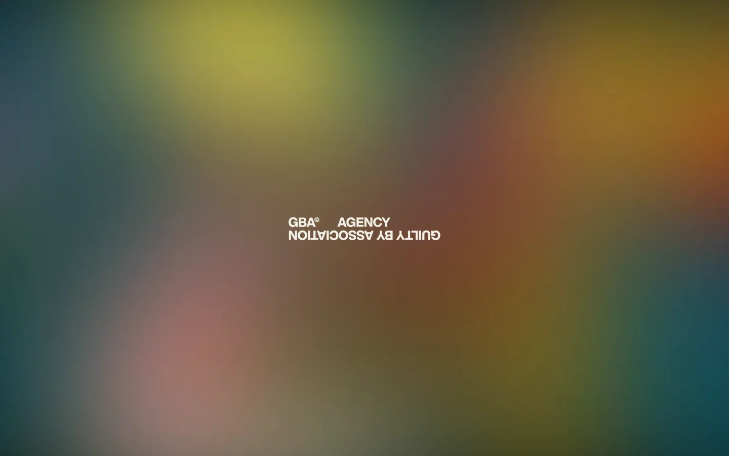 The desktop homepage features a minimalist design with a large, colorful blurred gradient background in shades of teal, yellow, and red. Centered in the frame is the white text 'GBA AGENCY' and 'GUILTY BY ASSOCIATION' displayed upside down.