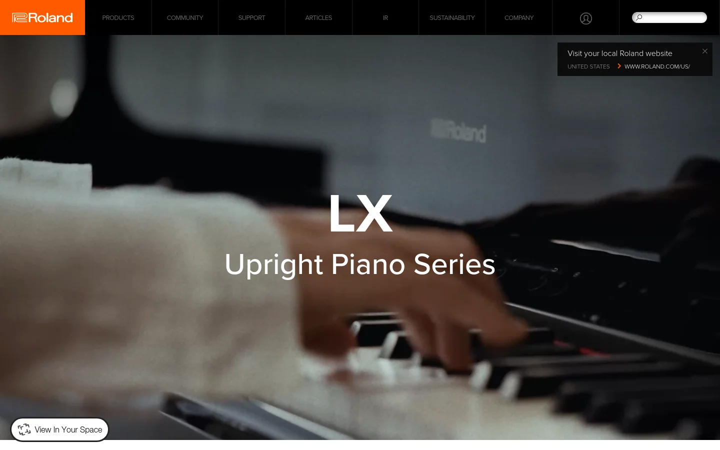 The desktop homepage features a large hero image of hands playing a piano with the headline 'LX Upright Piano Series' centered in white text. A dark navigation bar at the top includes the Roland logo, product categories, and a search bar. A 'View In Your Space' button is positioned in the bottom left corner over the dark, cinematic imagery.