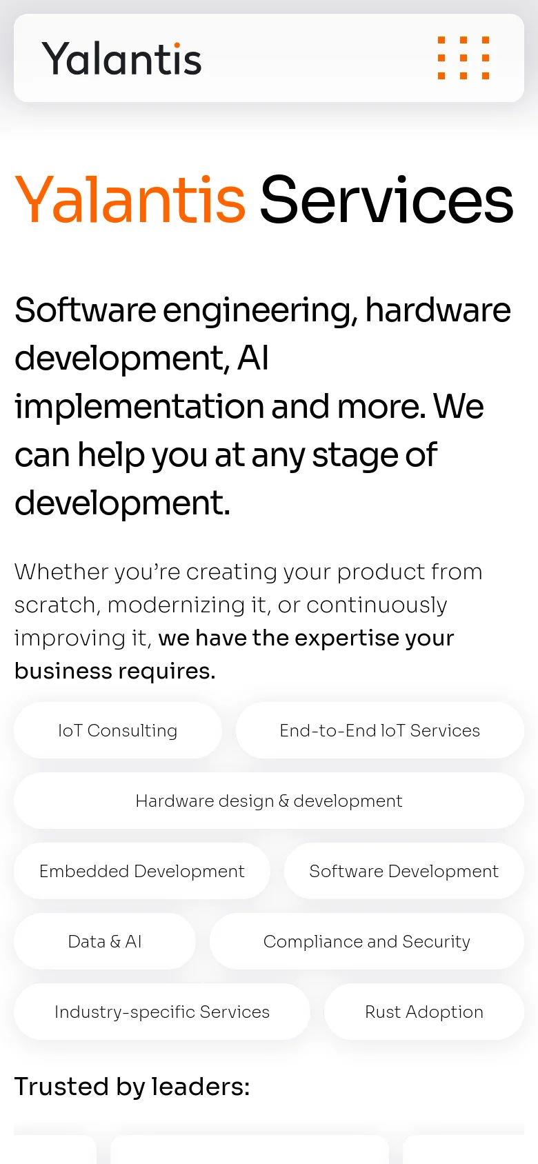 The mobile version presents a vertically stacked layout with the Yalantis logo and a hamburger menu at the top. The large headline and service description are centered, followed by service category buttons arranged in a single-column or staggered grid format. The 'Trusted by leaders' section follows, maintaining the same grayscale logo style as the desktop version.