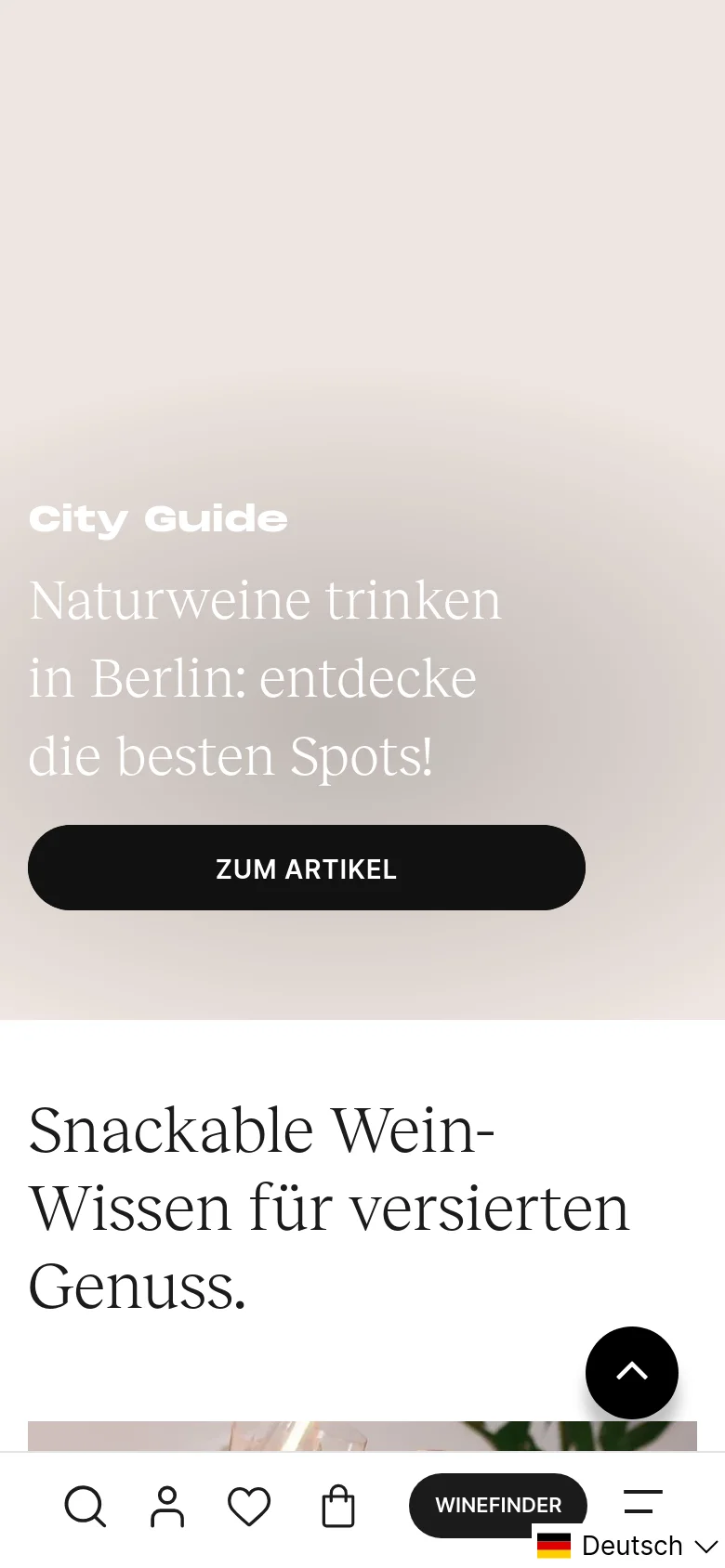 The mobile version maintains the beige hero section with centered white text and a large black call-to-action button. The layout shifts to a single-column view for the blog content, and a bottom navigation bar appears with icons for search, profile, favorites, shopping bag, a 'WINEFINDER' button, and a menu.
