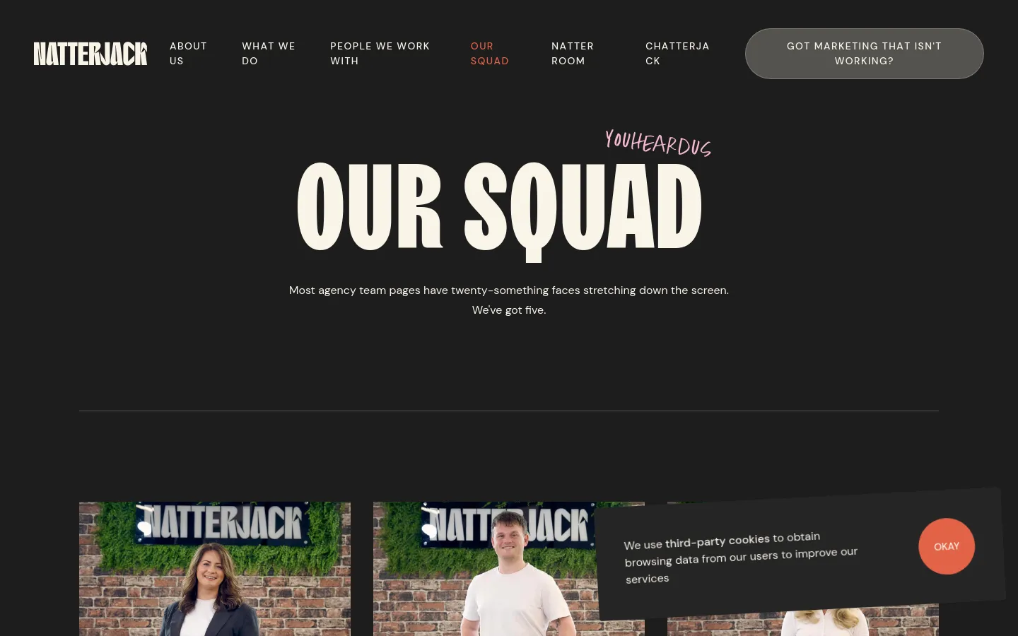 The desktop page features a dark theme with a large, cream-colored headline reading 'OUR SQUAD' and a subheadline about the team size. Below the hero section, a grid of team member portraits shows individuals in front of a brick wall with green foliage and a Natterjack sign. A navigation bar at the top includes links to various pages and a prominent 'GOT MARKETING THAT ISN'T WORKING?' call-to-action button.