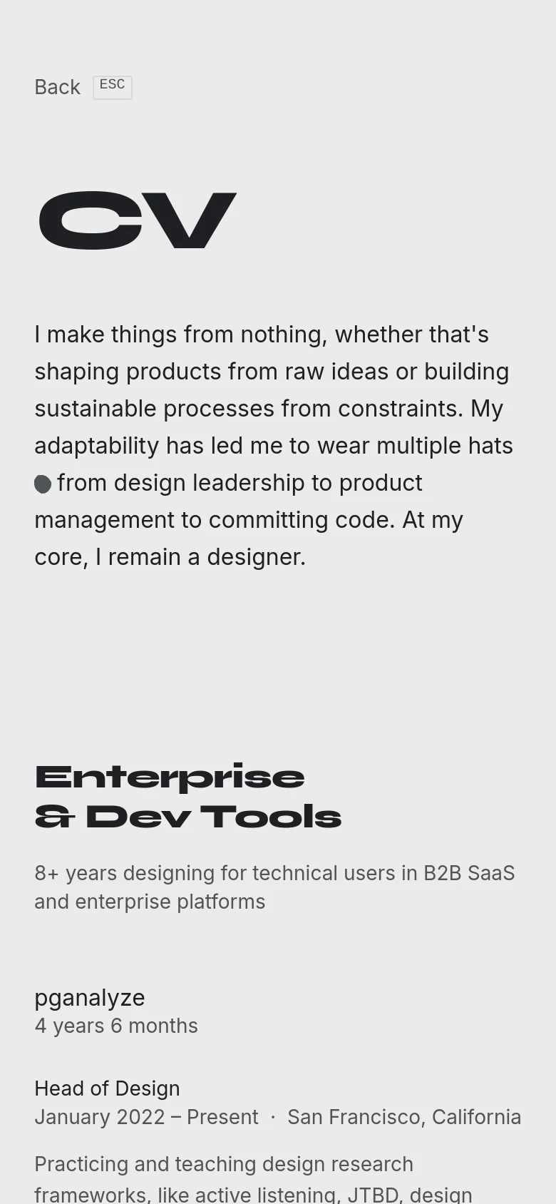 The mobile version maintains the minimalist white and black aesthetic but reflows the content into a single vertical column. The large ink-splatter graphic is removed or repositioned to prioritize the text, and the navigation links 'Back' and 'ESC' are placed at the top left.
