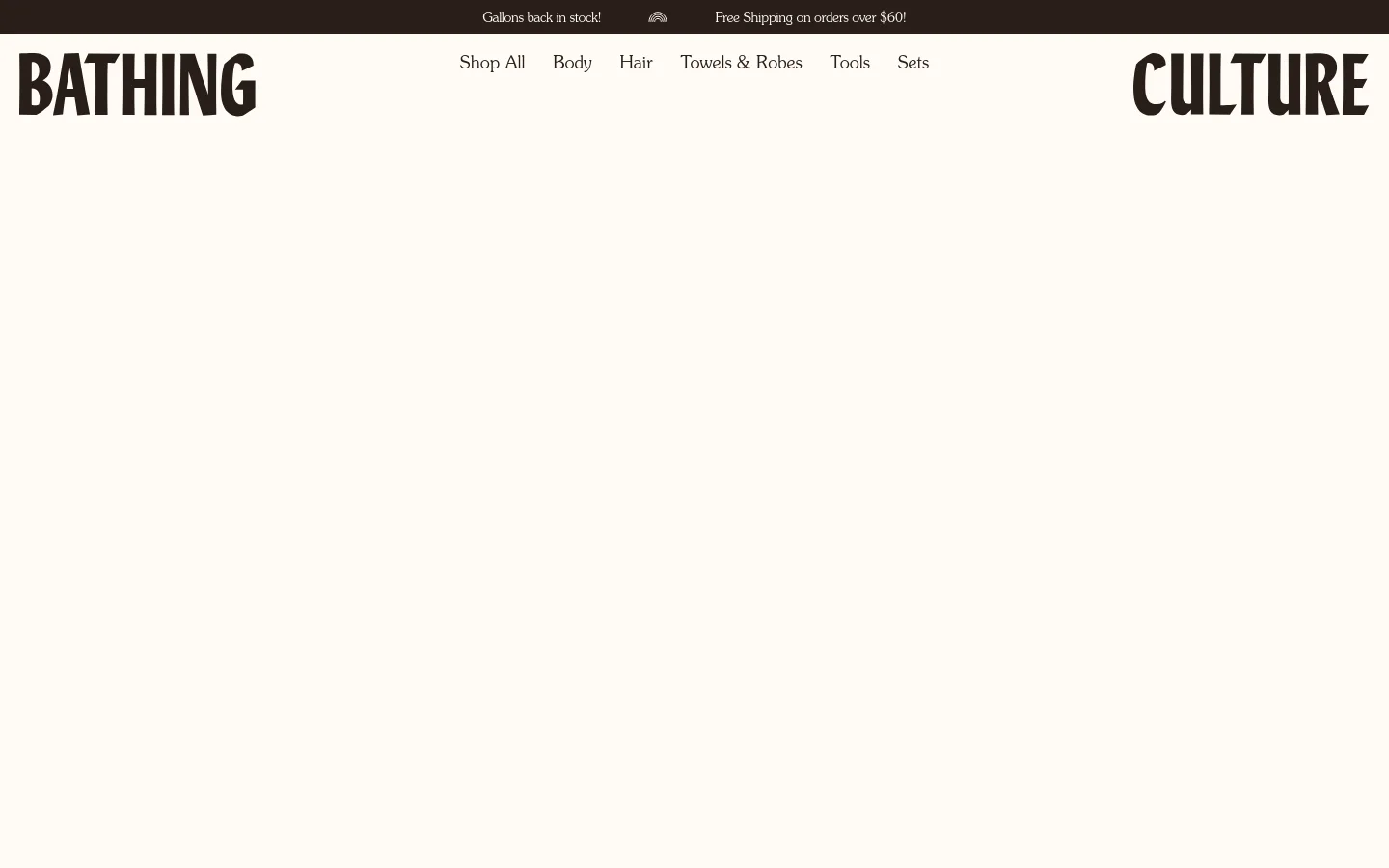 The desktop Contact page features a minimalist design with a cream background and large, bold black typography for the 'BATHING CULTURE' logo. A top announcement bar reads 'Gallons back in stock! Free Shipping on orders over $60!' and a navigation menu includes links for Shop All, Body, Hair, Towels & Robes, Tools, and Sets.