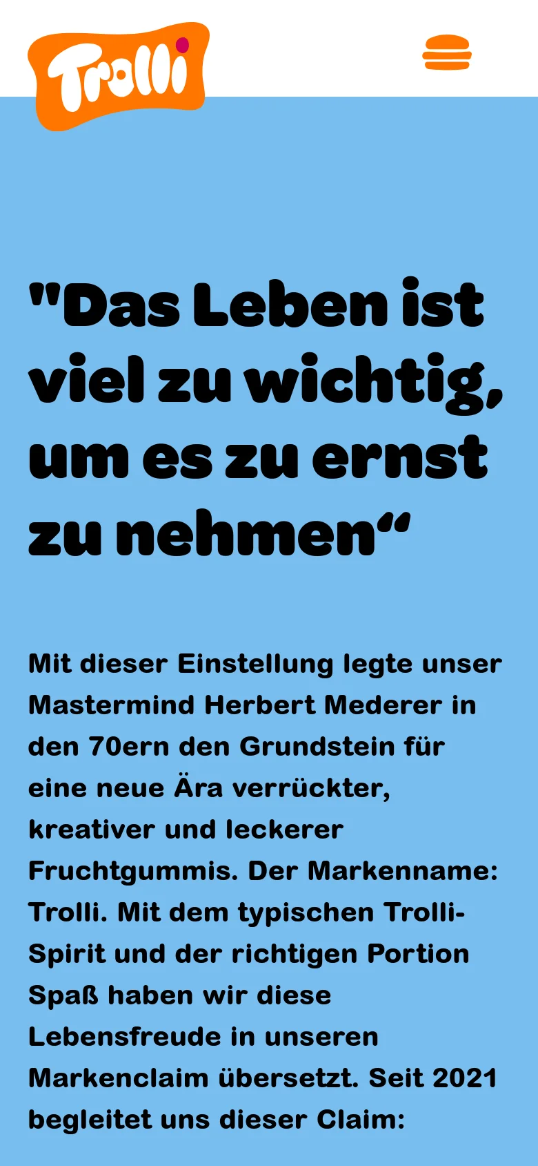 The mobile version shows a simplified layout with a large Trolli logo and a hamburger menu icon on a light blue background. The main headline is centered in large, bold black text, followed by a paragraph of descriptive text about the company's history and brand spirit. The multi-column desktop navigation is replaced by a single-column vertical stack.