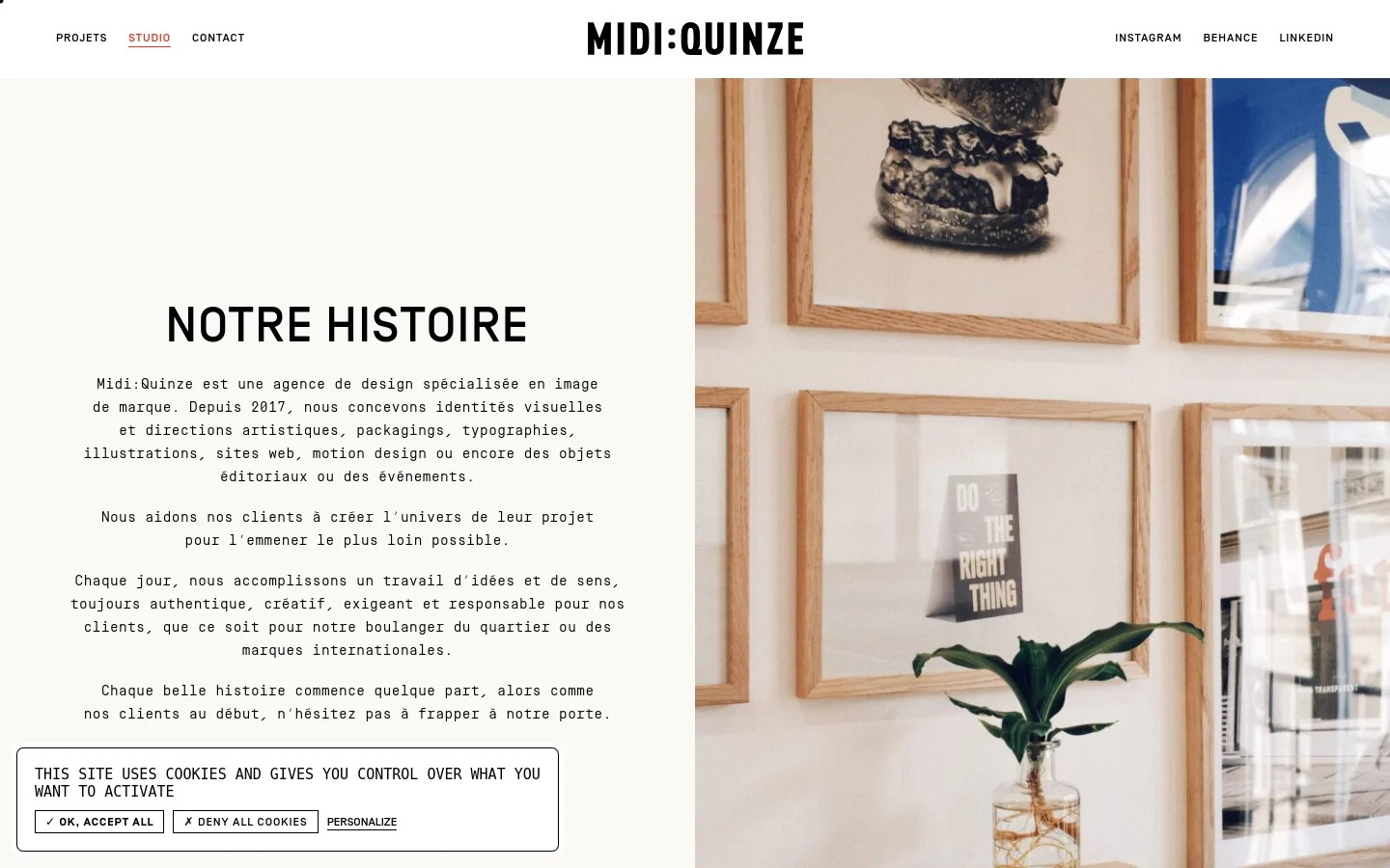 The desktop version features a minimalist layout with a split-screen design. On the left, a clean white section contains the headline 'NOTRE HISTOIRE' followed by several paragraphs of text in a black sans-serif font. The right side displays a large, warm-toned photograph of a studio interior with framed art and a potted plant. A cookie consent banner appears at the bottom left.