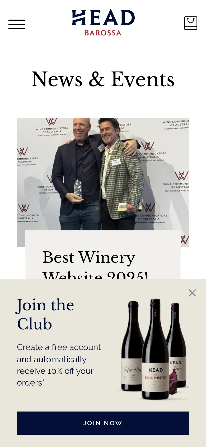 The mobile version simplifies the layout, stacking content vertically for easier scrolling. The header displays a hamburger menu icon, the brand logo, and a shopping bag, while the hero section features the award-winning news story with a large image of two men. A prominent 'Join the Club' pop-up overlay at the bottom shows wine bottles and a dark blue 'JOIN NOW' button.