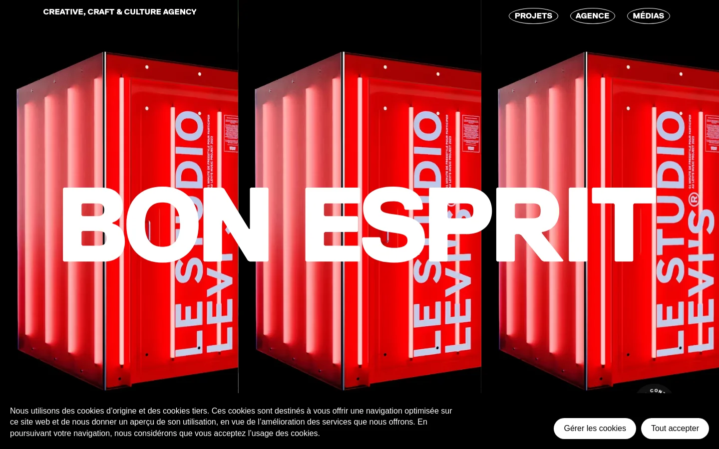 The desktop homepage features a black background with a large, vibrant red neon structure as the hero image, overlaid with the bold white text 'BON ESPRIT'. A navigation menu with links for 'PROJETS', 'AGENCE', and 'MÉDIAS' is positioned at the top right, while a cookie consent banner appears at the bottom. The layout is minimalist and high-contrast.