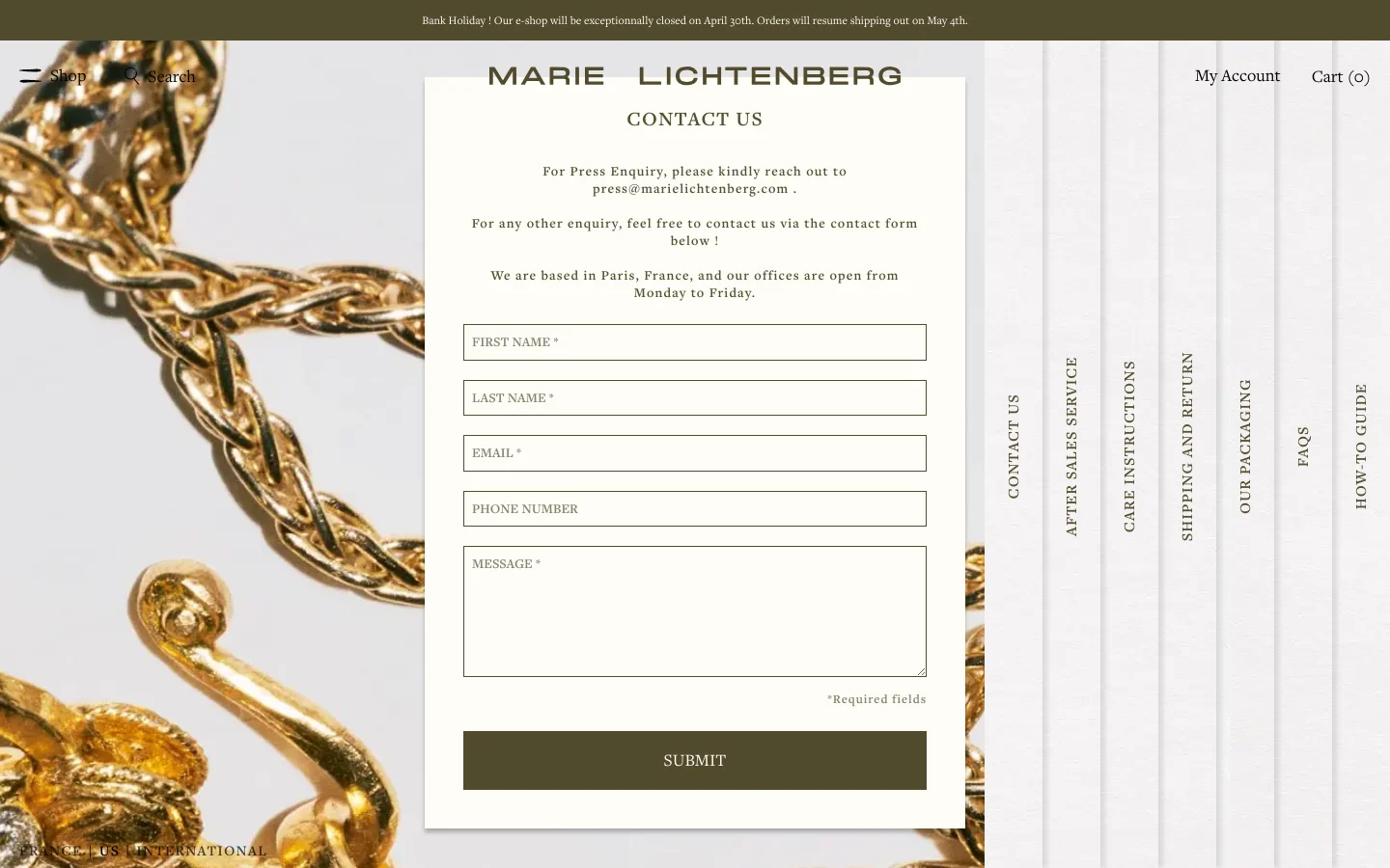 The desktop Contact Us page features a minimalist design with a large, high-quality background image of gold jewelry. A central white overlay contains the page title, contact instructions for press and general inquiries, and a contact form with fields for first name, last name, email, phone number, and message. The navigation menu and brand logo are visible at the top, with a dark olive green submit button at the bottom of the form.