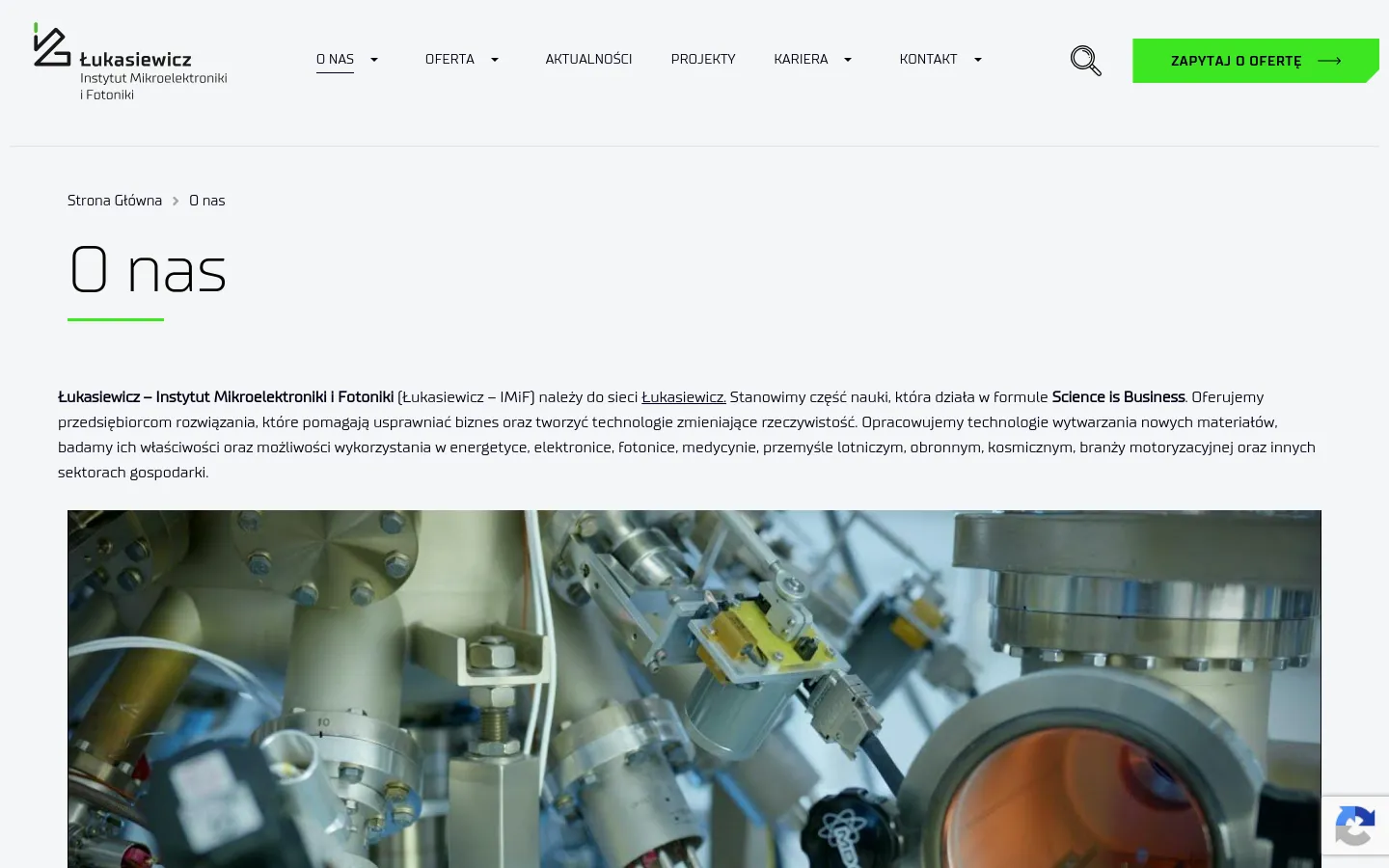Desktop view of the 'O nas' page featuring a clean white and light gray layout with a top navigation bar containing the Łukasiewicz logo, menu links, a search icon, and a bright green 'ZAPYTAJ O OFERTĘ' button. The main content area displays a breadcrumb trail, a large 'O nas' heading underlined in green, introductory text, and a wide hero image showing complex laboratory scientific equipment.