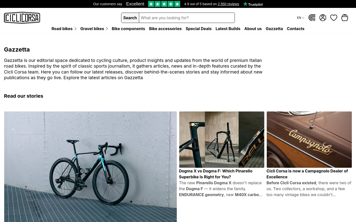 The desktop view shows the Gazzetta editorial page with a white background and black text. A large headline 'Gazzetta' is followed by an introductory paragraph, leading into a 'Read our stories' section featuring a grid of large article cards with high-quality photography of road bikes and cycling components. The navigation bar at the top includes the Cicli Corsa logo, a search bar, and links to various bike categories and brand collections.