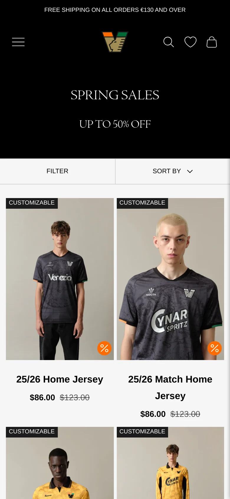 The mobile version presents a simplified black header with a hamburger menu, the Venezia FC logo, and icons for search, favorites, and shopping. The hero section remains black with white sale text, followed by a single-column product grid showing jersey images, titles, and sale prices. The 'Filter' and 'Sort By' buttons are prominently stacked above the product list.