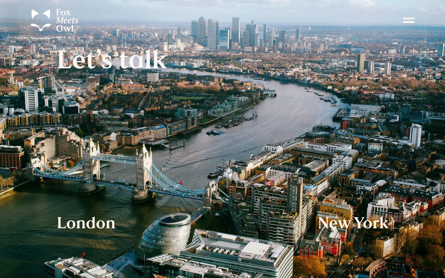 The desktop page features a large hero image of the London skyline and Tower Bridge with the text 'Let's talk', 'London', and 'New York' overlaid in white. Below the hero, a bright red section displays the contact email 'coach@foxmeetsowl.com' in large white text. The rest of the page uses a cream background to list global work regions by continent and includes a stylized world map illustration.