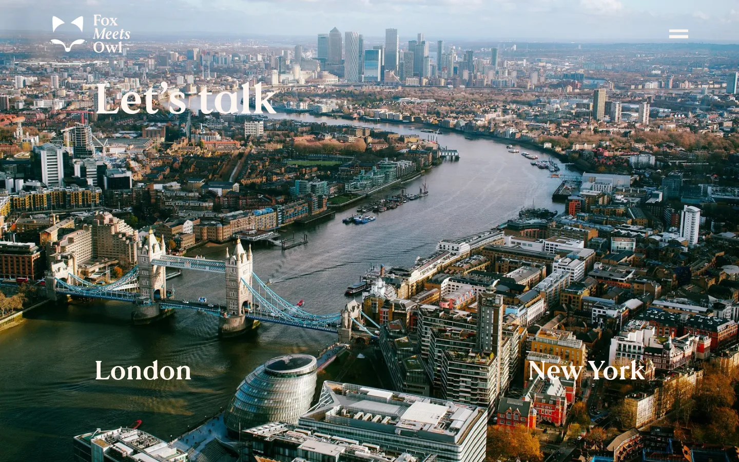 The desktop page features a large hero image of the London skyline and Tower Bridge with the text 'Let's talk', 'London', and 'New York' overlaid in white. Below the hero, a bright red section displays the contact email 'coach@foxmeetsowl.com' in large white text. The rest of the page uses a cream background to list global work regions by continent and includes a stylized world map illustration.