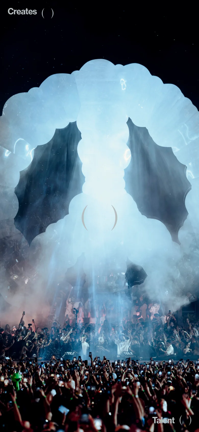 The mobile version presents a vertically oriented view of the hero image, focusing on the large, bright white light installation and the crowd below. The navigation menu is simplified, and the brand text 'Creates' and 'Talent' are repositioned to fit the narrow screen. The overall aesthetic remains dark and immersive, prioritizing the visual impact of the production photography.