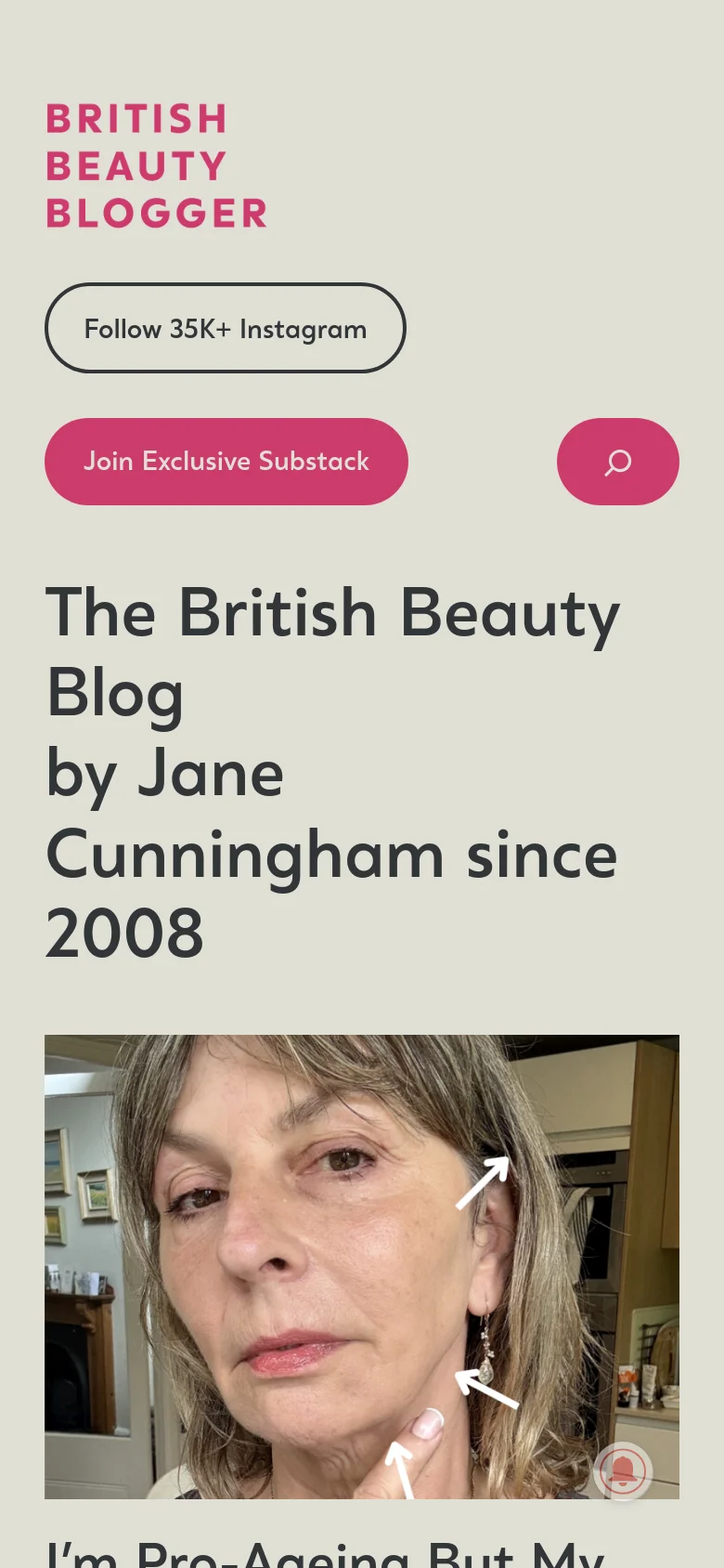 The mobile version presents a vertically stacked layout optimized for small screens. The header elements, including the logo and buttons, are centered and enlarged, while the featured article image spans the full width of the screen below the main title.