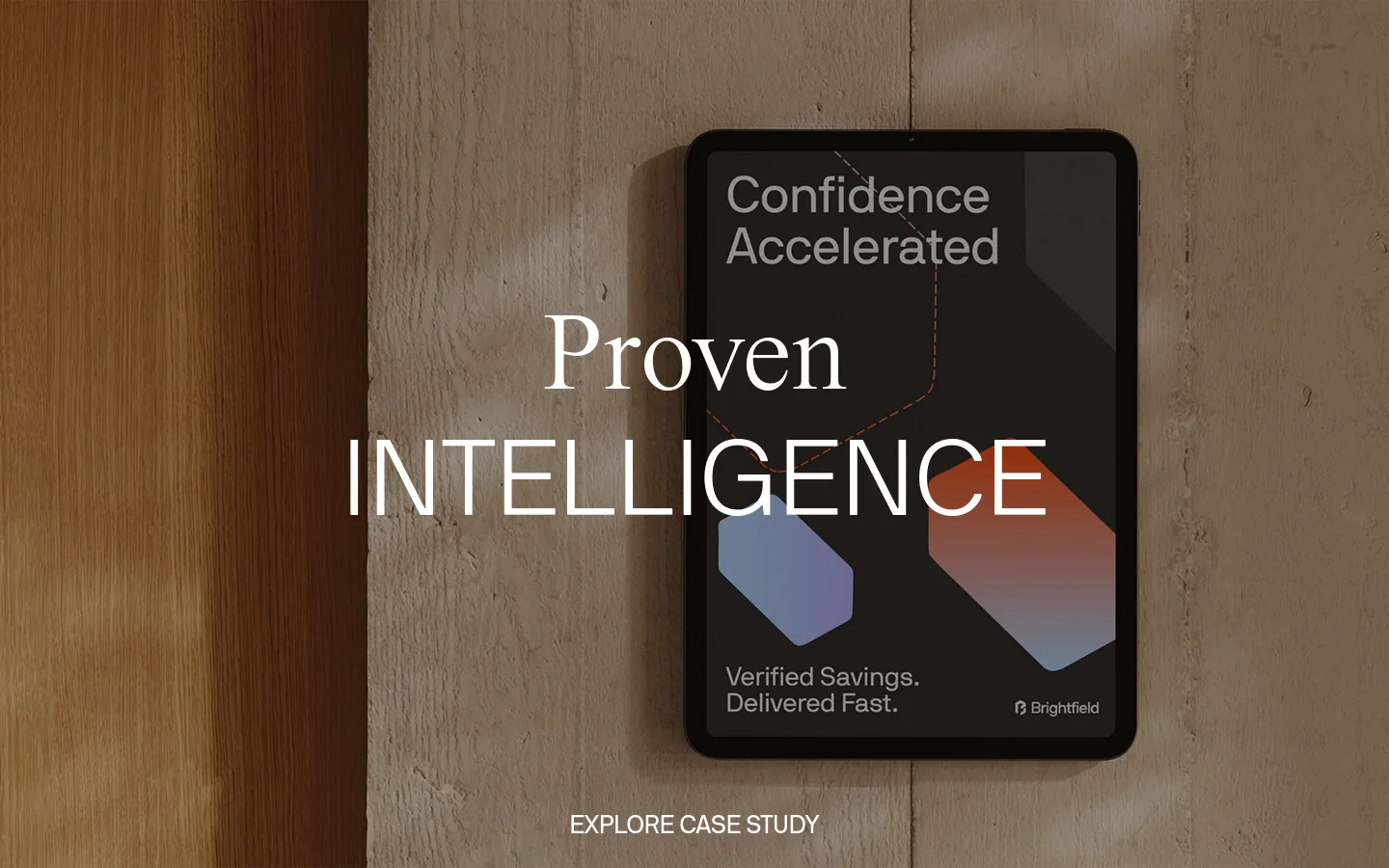 The desktop homepage features a minimalist white background with black typography. A large hero section displays a high-quality photograph of a tablet on a textured stone surface with the headline 'Proven Intelligence' and a call to action to 'Explore Case Study'. Below, a grid layout showcases design projects and a 'Masterful Mockups' section with product images.