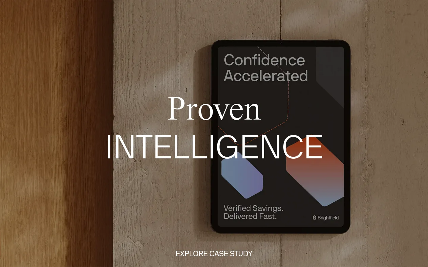 The desktop homepage features a minimalist white background with black typography. A large hero section displays a high-quality photograph of a tablet on a textured stone surface with the headline 'Proven Intelligence' and a call to action to 'Explore Case Study'. Below, a grid layout showcases design projects and a 'Masterful Mockups' section with product images.