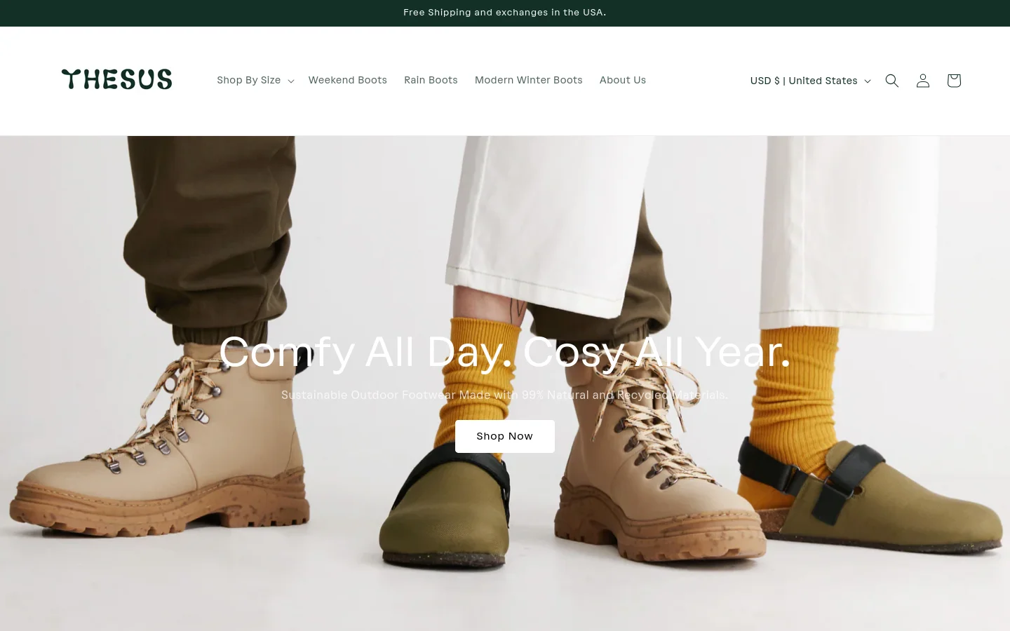The desktop homepage features a clean, minimalist design with a white background and dark green accents. A large hero image shows a person wearing tan hiking boots and mustard yellow socks, overlaid with the headline 'Comfy All Day. Cosy All Year.' and a 'Shop Now' button. The navigation menu at the top includes links for footwear categories and an account icon.
