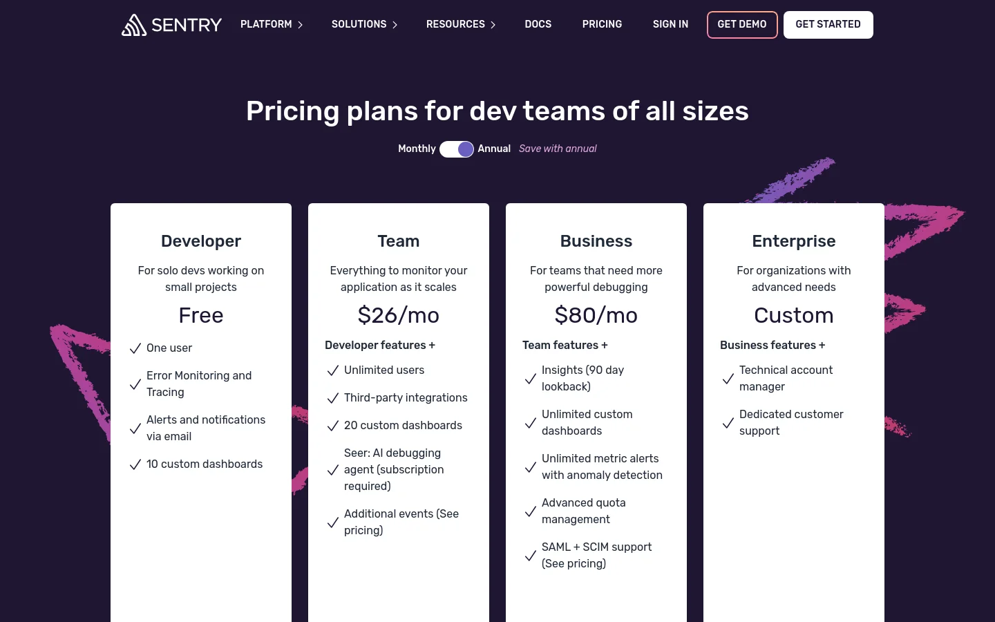 The desktop pricing page features a dark purple background with a large white headline reading 'Pricing plans for dev teams of all sizes.' Below a monthly/annual toggle switch, four white pricing cards for Developer, Team, Business, and Enterprise are arranged horizontally. Each card lists the plan name, price, and a bulleted list of features with checkmarks.