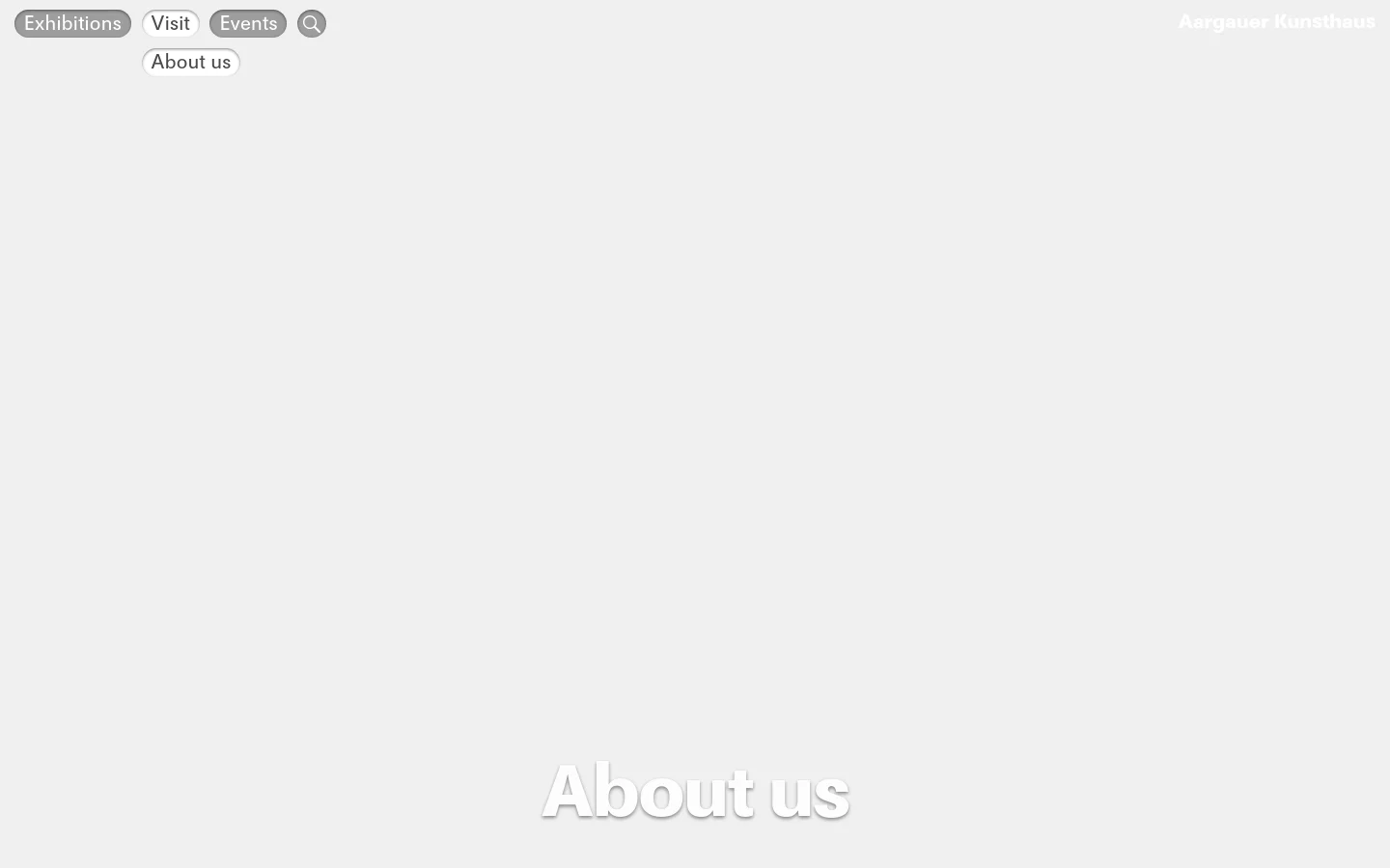 The desktop version features a large hero image of a modern architectural staircase with green-tinted glass panels and the headline 'About us' in large white text. A minimalist navigation bar at the top includes links for Exhibitions, Visit, Events, and About us, alongside a search icon and the museum name.