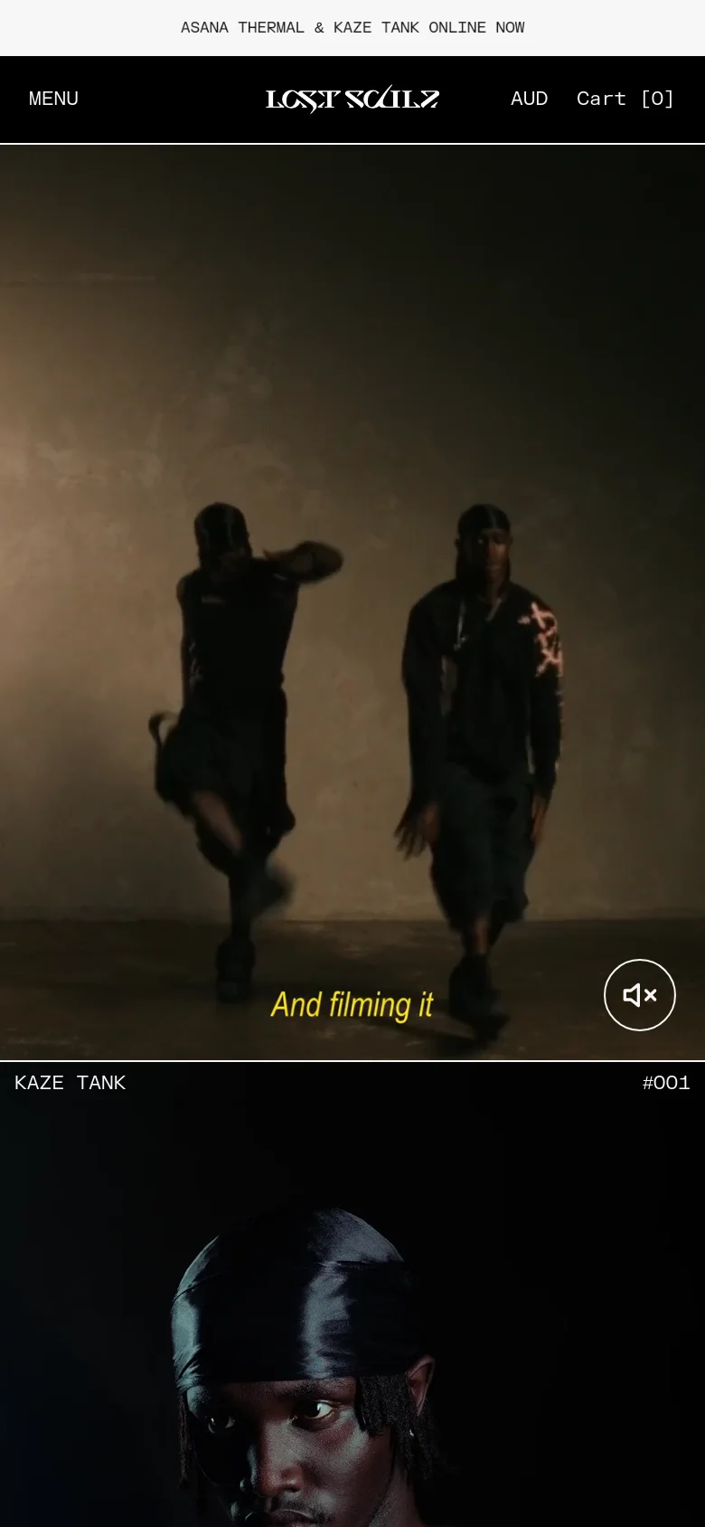 The mobile version presents a vertically oriented, dark-themed layout optimized for smaller screens. The header is simplified to a 'MENU' button, the brand logo, currency selection, and a shopping cart icon. The hero section features a large, immersive video background with the text 'And filming it' and a muted volume icon.