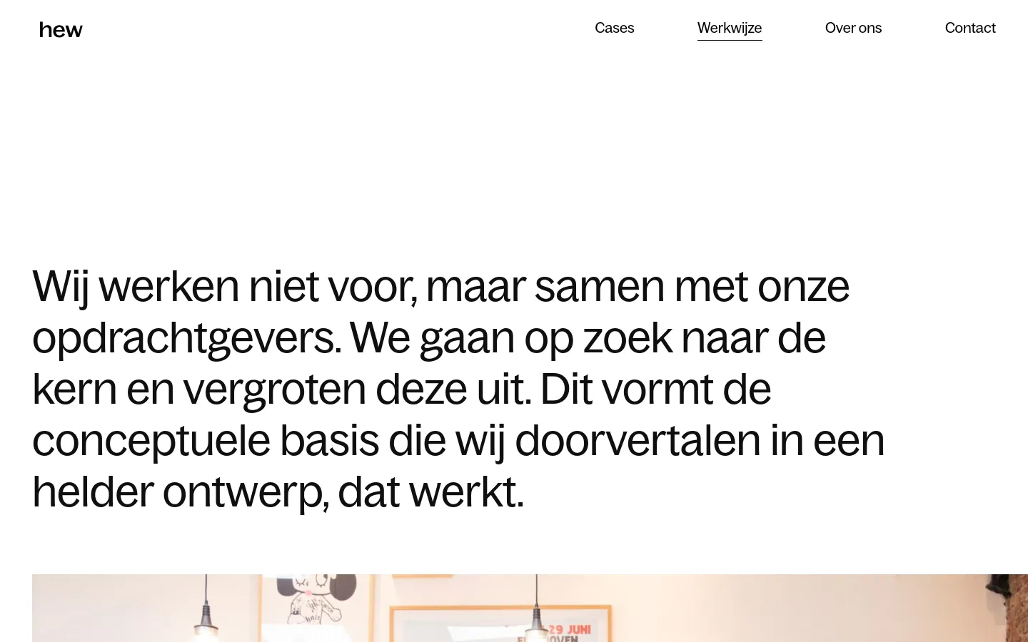 The desktop page features a minimalist white background with a large, bold black headline about the studio's collaborative approach. A horizontal navigation menu is located at the top right, and a wide atmospheric photo of a studio workspace is positioned below the main text.