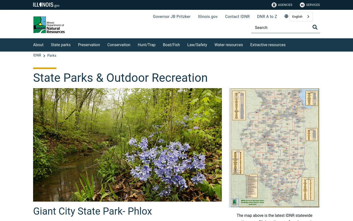 The desktop page features a dark blue navigation bar with links to About, State Parks, and Conservation. The main content area displays a large hero image of blue phlox flowers by a stream in a forest, a headline reading 'State Parks & Outdoor Recreation', and a large interactive map of Illinois state properties on the right side.