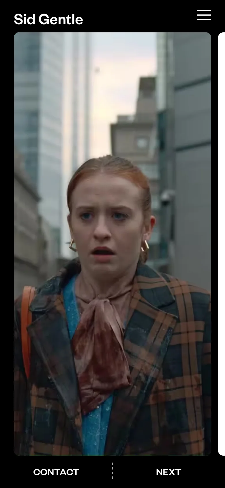 The mobile version maintains the dark aesthetic but simplifies the layout. The logo is centered at the top, and a hamburger menu icon is positioned at the top right. The cinematic hero image fills the screen, with 'Contact' and 'Next' navigation options appearing at the bottom.