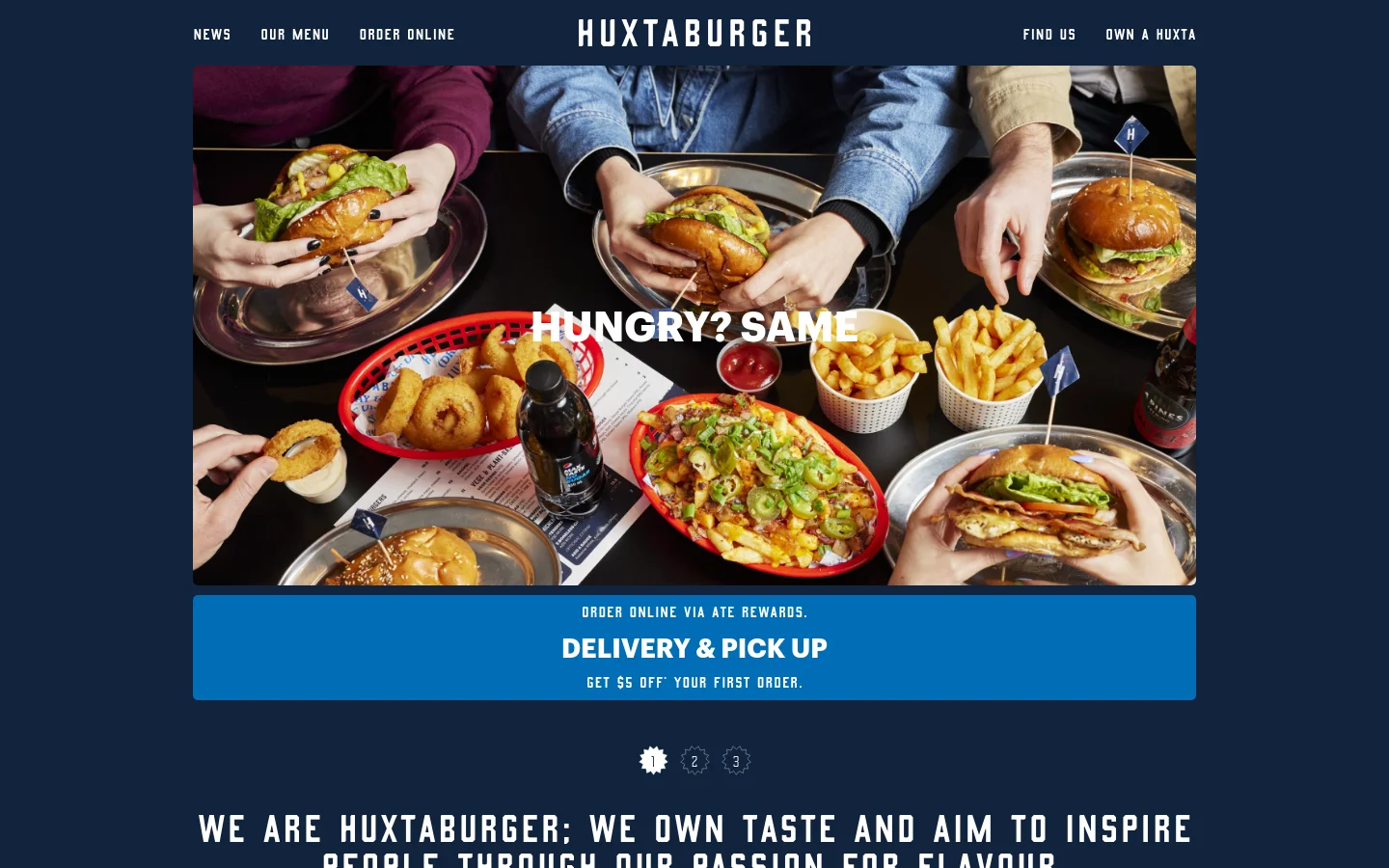 The desktop homepage features a dark navy background with a large hero image of people sharing burgers, fries, and onion rings. A central headline reads 'HUNGRY? SAME' over the food, followed by a bright blue call-to-action banner for 'DELIVERY & PICK UP'. The navigation bar at the top includes links for News, Our Menu, Order Online, Find Us, and Own a Huxta.