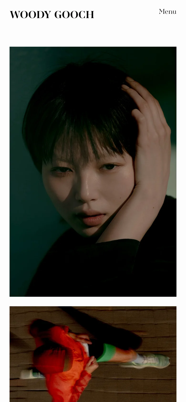 The mobile version simplifies the layout, placing the 'WOODY GOOCH' logo and a 'Menu' button at the top of the screen. The main content consists of large, vertically stacked photographic images, starting with a close-up portrait of a person in dramatic lighting.