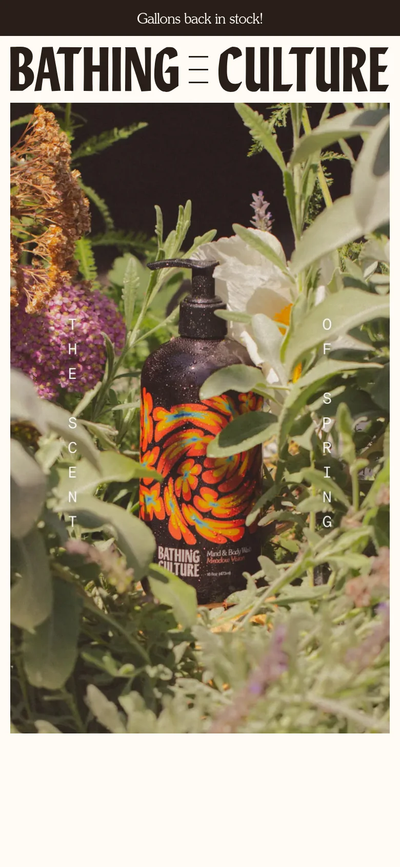 The mobile version presents a vertically oriented view of the hero image, focusing on the soap bottle surrounded by dense foliage and flowers. The navigation menu is condensed into a hamburger icon next to the brand name, and the top announcement bar remains visible, maintaining the natural, earthy aesthetic.