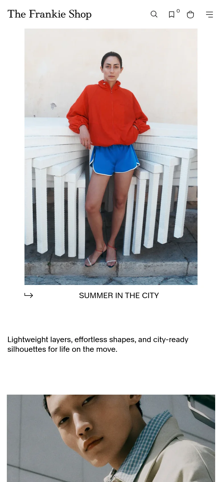 The mobile version of the homepage presents a single-column vertical layout. A large hero image of a model in a red jacket and blue shorts dominates the screen, followed by the 'SUMMER IN THE CITY' heading and descriptive text. The navigation is condensed into a hamburger menu and icons at the top of the screen.