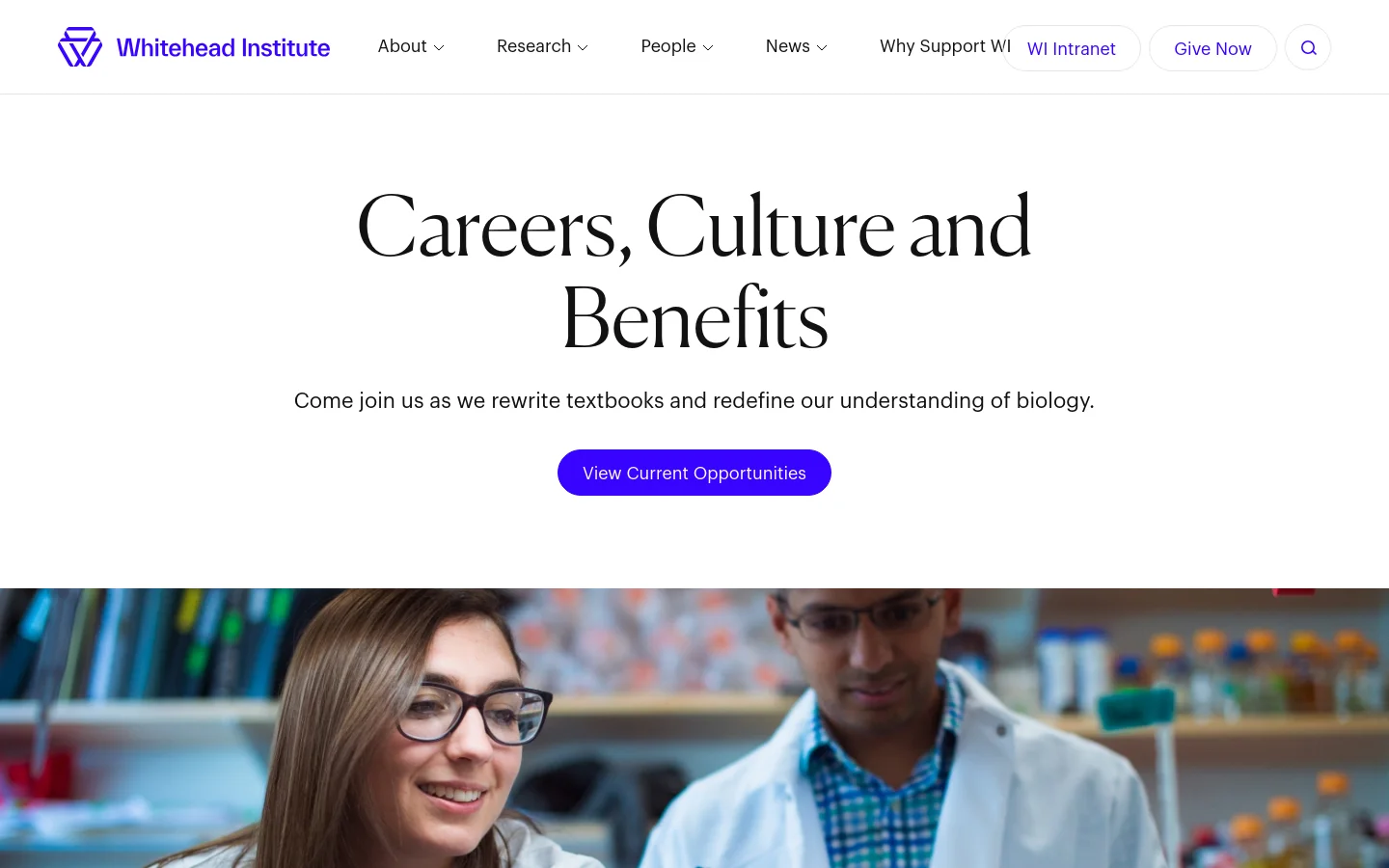 The desktop page features a clean white background with a large serif headline reading 'Careers, Culture and Benefits' and a purple 'View Current Opportunities' button. Below the header, a wide hero image shows two scientists in lab coats working in a bright laboratory setting. A top navigation bar includes links for About, Research, People, News, and buttons for WI Intranet and Give Now.