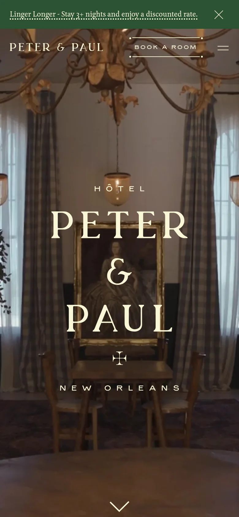 The mobile version presents a vertically oriented view of the same elegant hotel interior hero image. The typography is centered and scaled for a smaller screen, with the 'Hotel Peter & Paul' title dominating the center. The top navigation is simplified, showing the hotel name, a 'Book a Room' button, and a hamburger menu icon, while the promotional banner remains at the top.